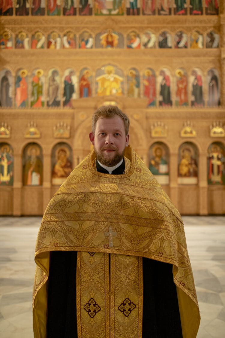 Priest Standing Near Iconostasis