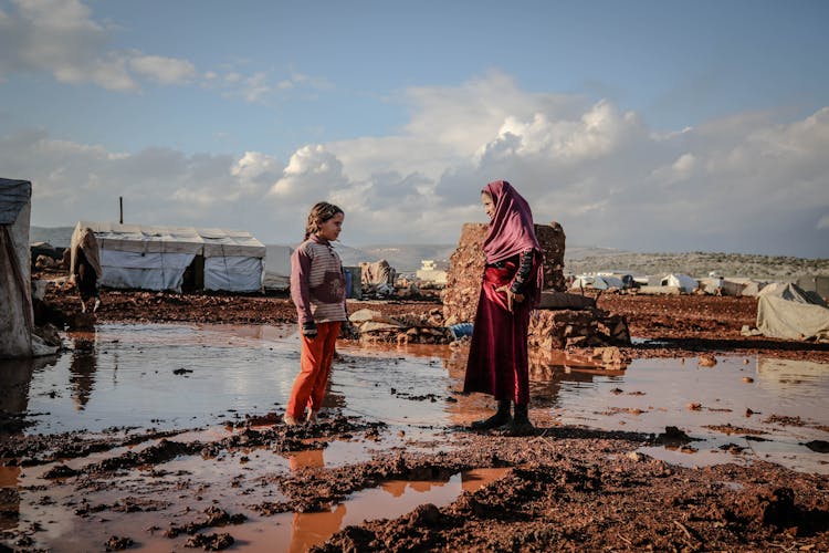 Woman In Hijab Talking With Girl