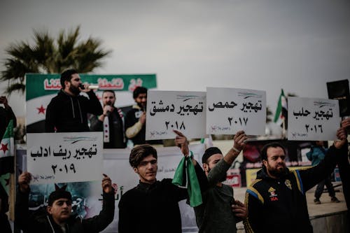 Group of Protesters holding Placards