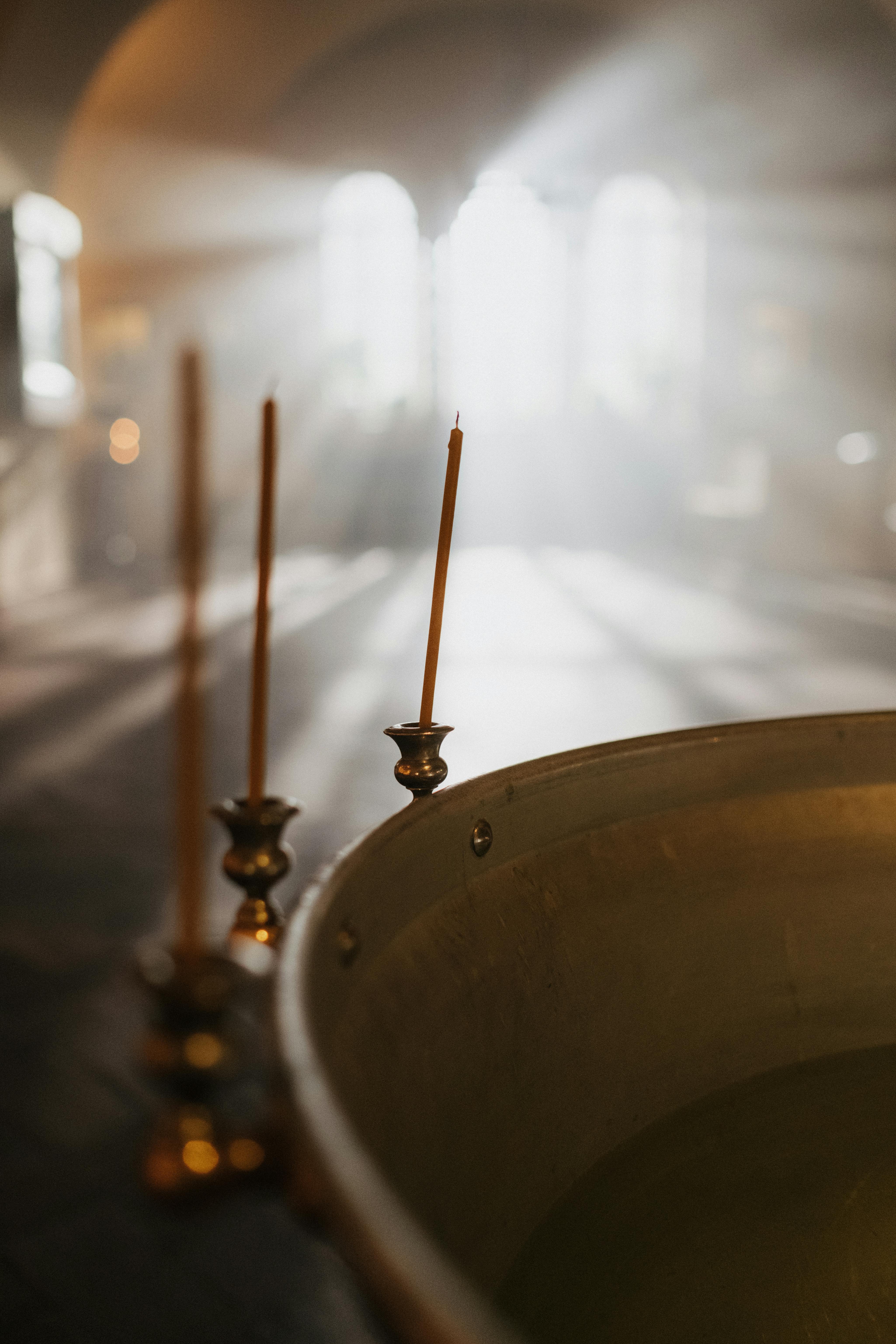 Candles Near the Baptismal Font · Free Stock Photo