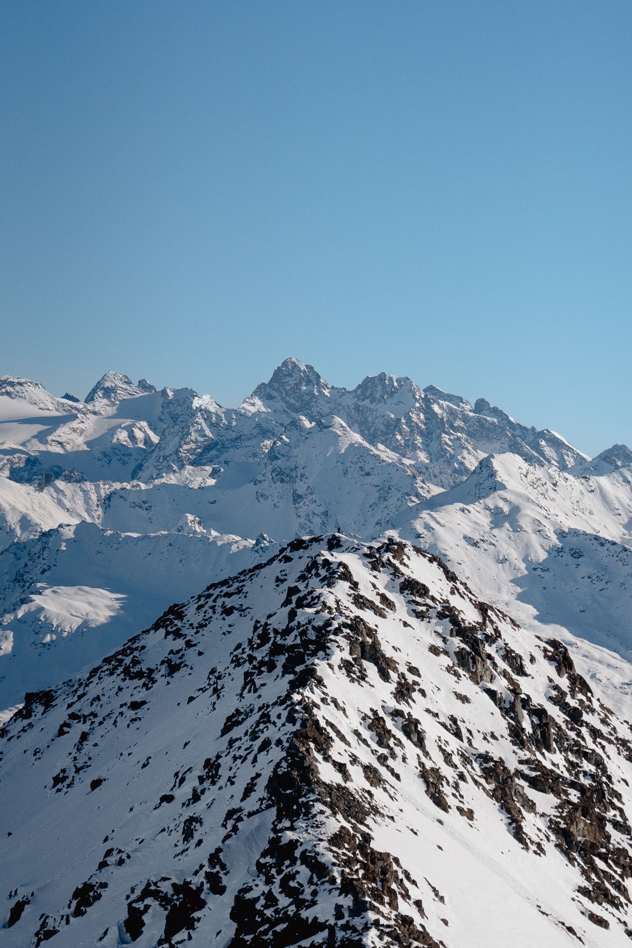 Snow Covered Mountains Under Blue Sky · Free Stock Photo
