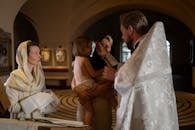 Priest Praying For a Child