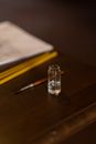 Close-up of Bottle of Holy Water and Paintbrush in Orthodox Church