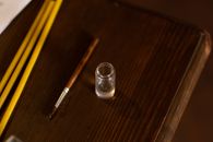 High Angle View of Bottle of Holy Water and Paintbrush in Orthodox Church