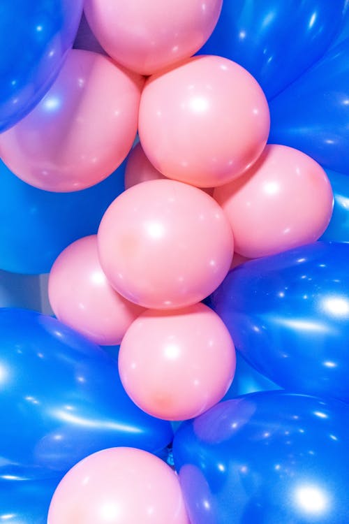 A Close-Up Shot of Blue and Pink Balloons