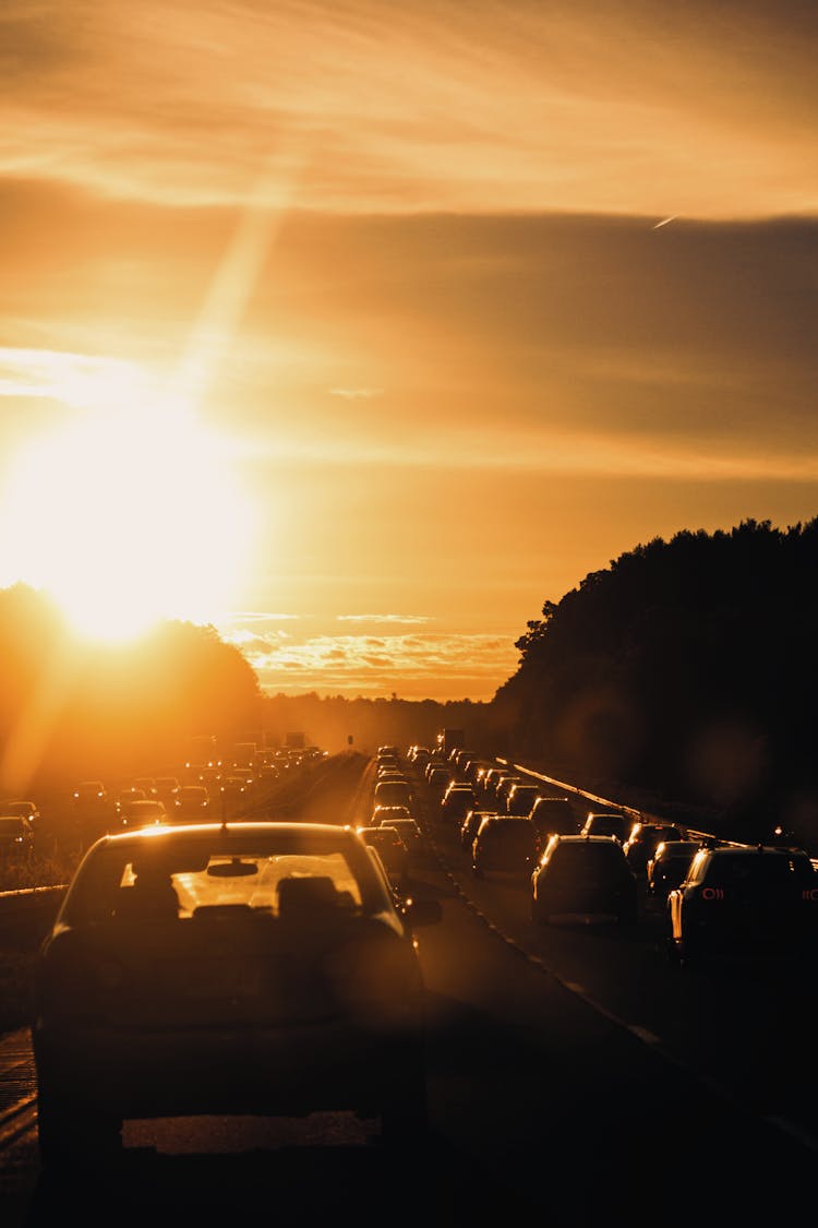 Traffic Jam On Highway At Sunset