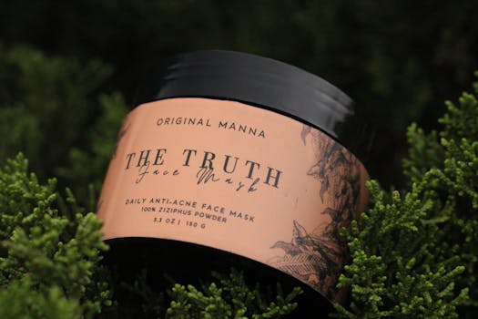 Face mask container amidst lush green foliage, emphasizing natural skincare.