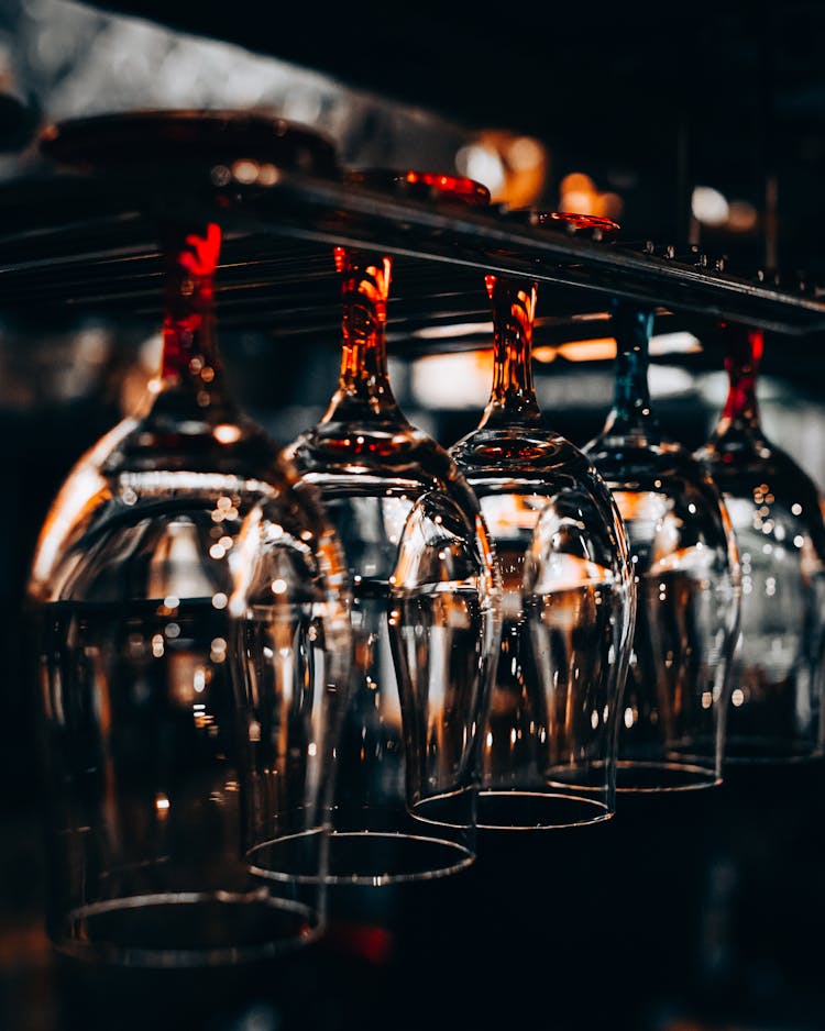 Wineglasses Hanging Upside Down At Bar