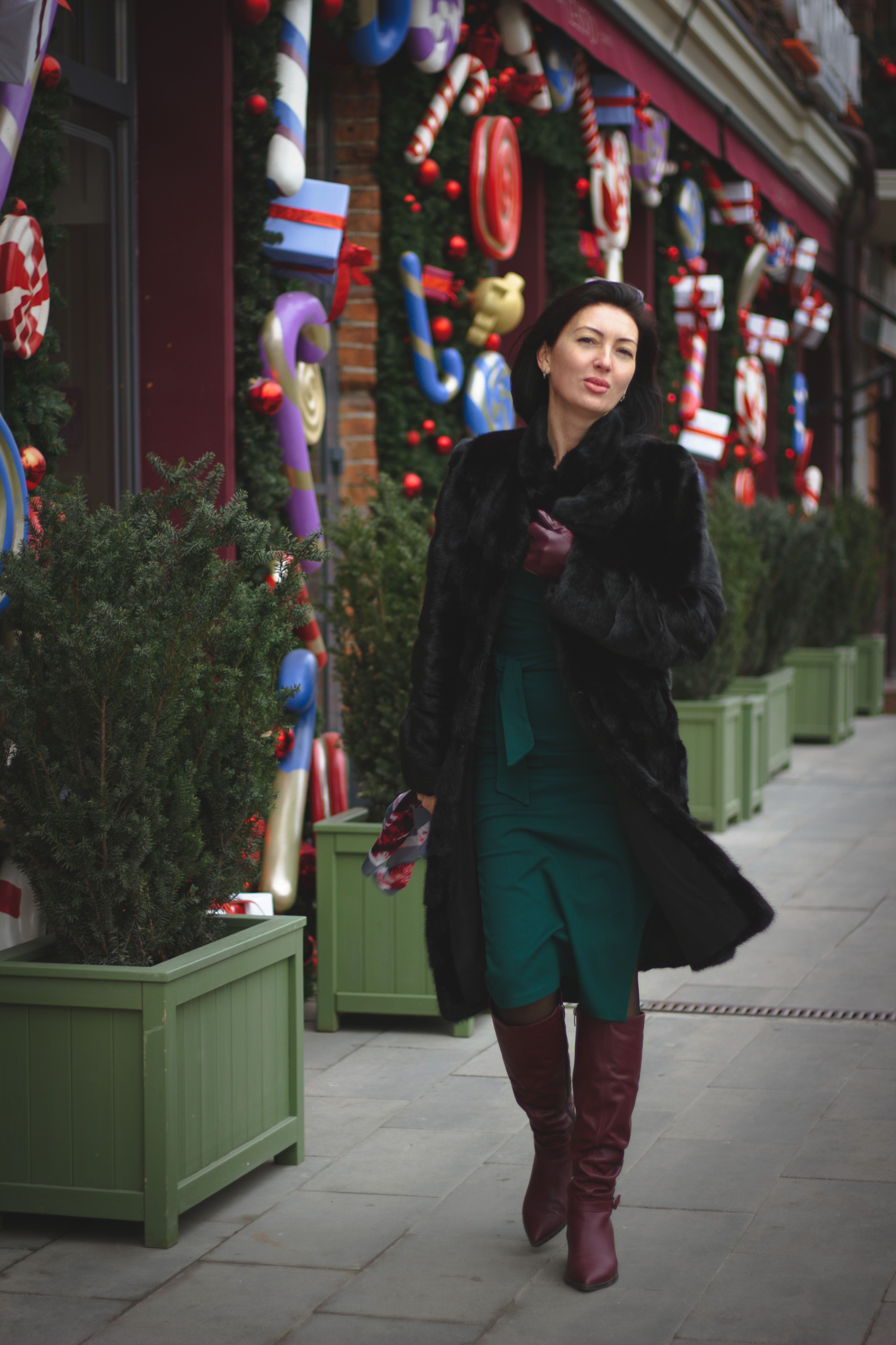 Woman in Black Coat Walking on Sidewalk · Free Stock Photo
