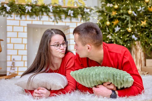 Couple Wearing Red Long Sleeves Pouting Their Lips 