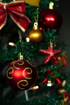 Close-up of decorated Christmas tree with vibrant ornaments and twinkling lights.