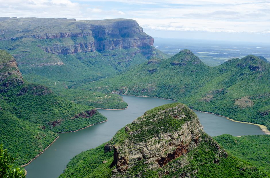 Unforgettable Full Day Shared Shark Cage Diving Adventure in Gansbaai Review: An Unforgettable South African Encounter Review 2026 - Enjoy the breathtaking aerial view of a lush green canyon landscape with a winding river.