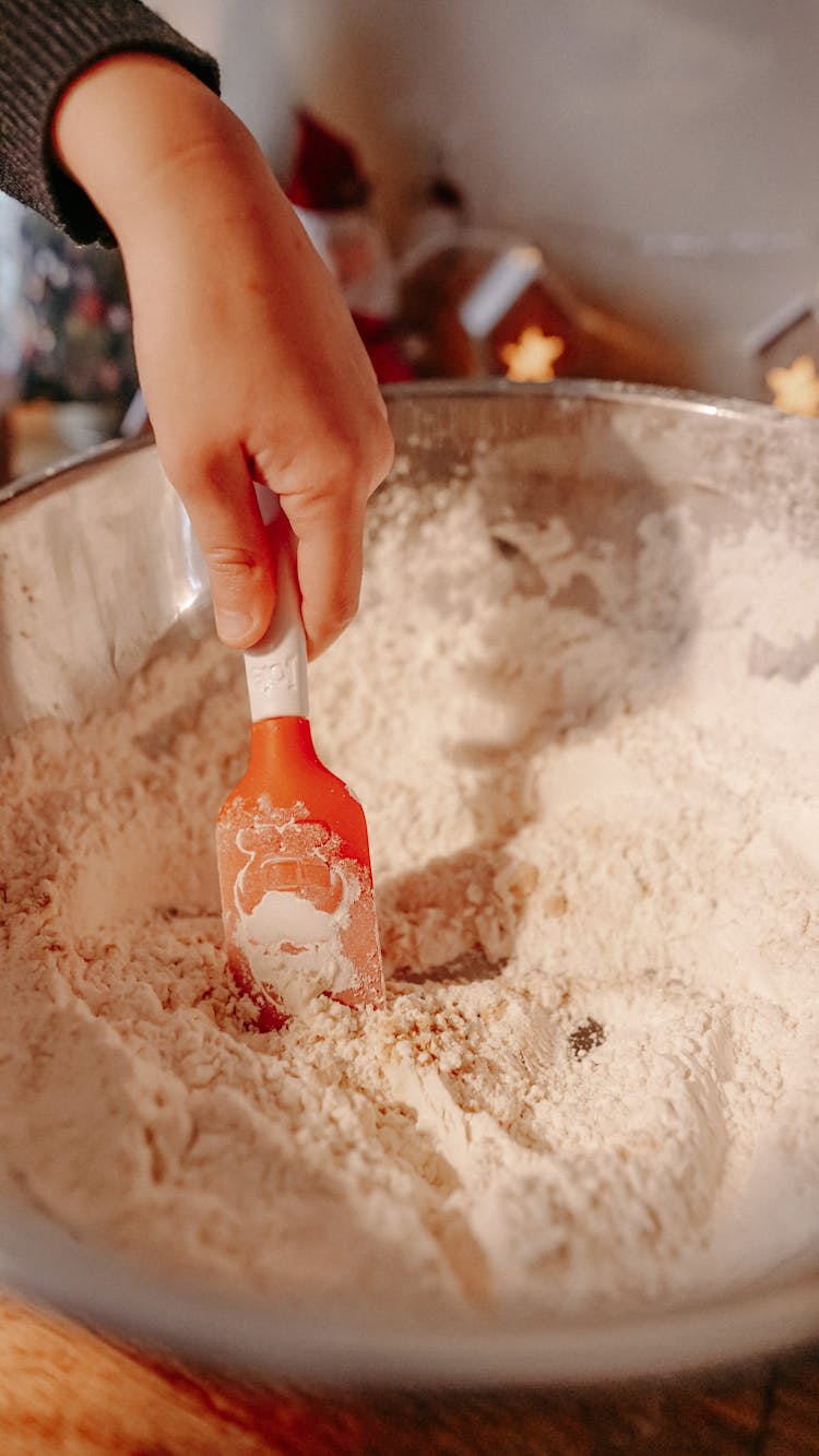 Close-up View Of Child Hand Kneading Dough