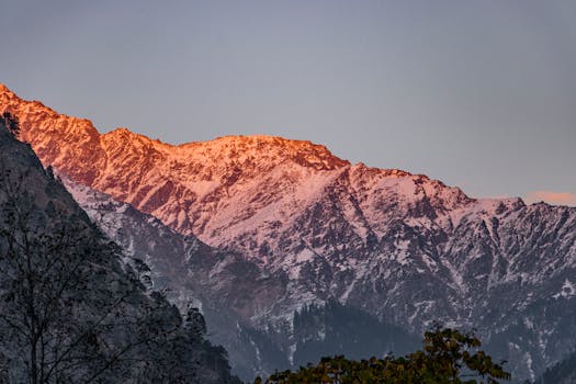 Majestic sunset view of snow-capped Himalayas in Himachal Pradesh, India.