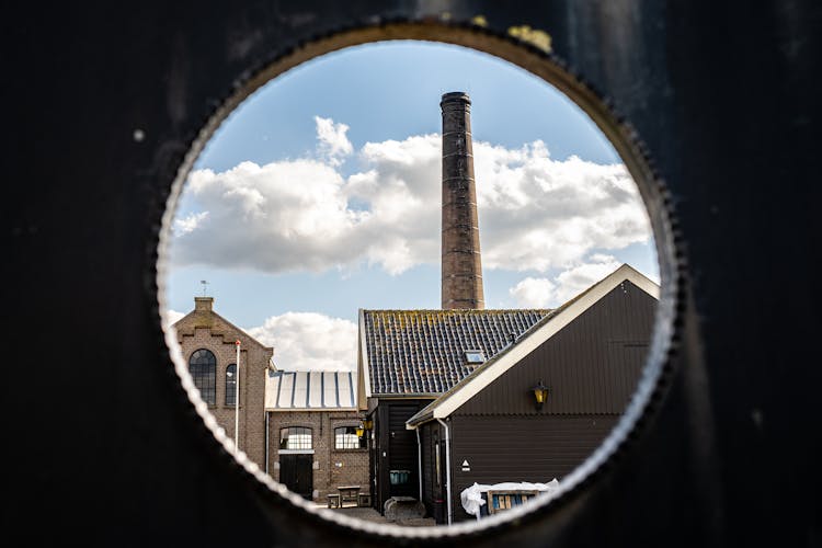 Brick Warehouse With Exhaust Pipe Through A Hole 