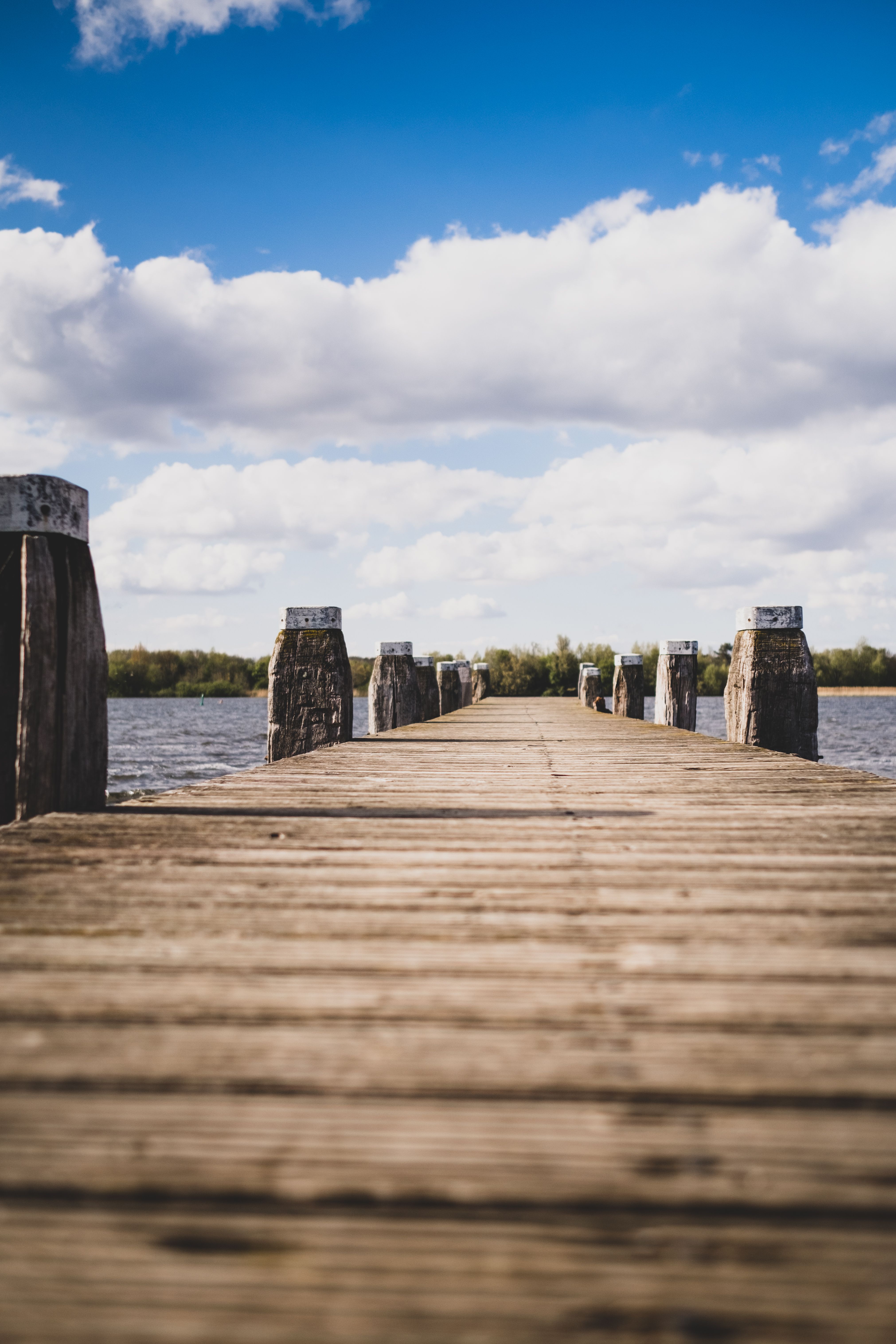 Wooden Dock Under Cloudy Sky · Free Stock Photo