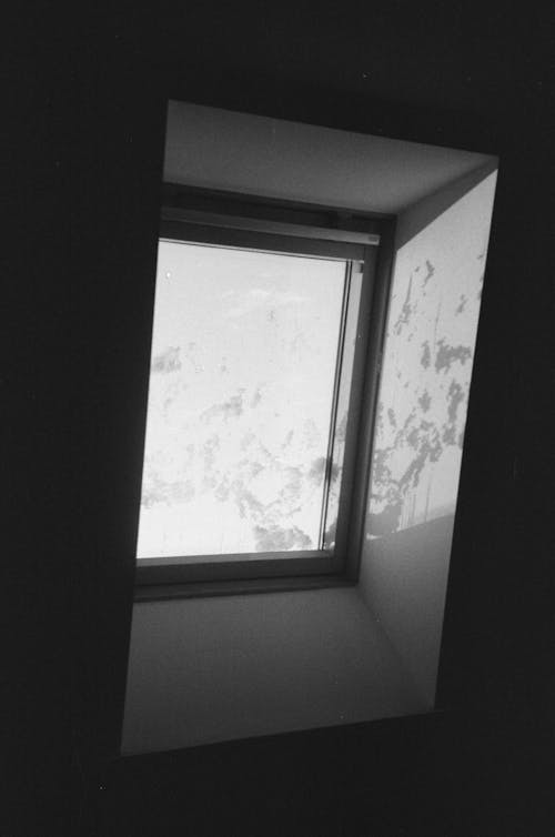 Grayscale Photography of Glass Window 