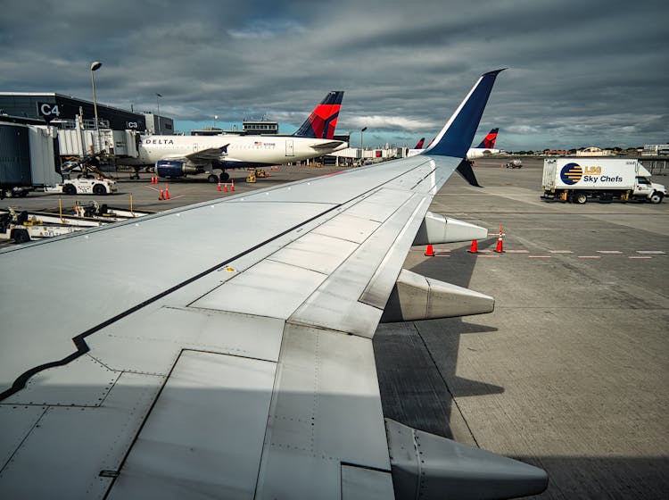 View Of An Airplane Wing On An Airport