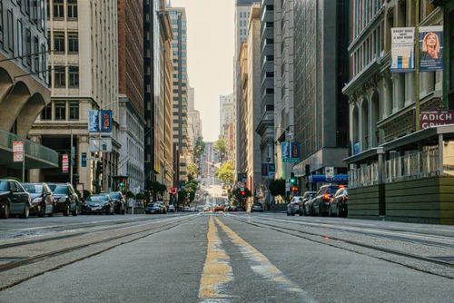 Free A bustling urban street view showcasing San Francisco's iconic cityscape with busy traffic and tall buildings. Stock Photo