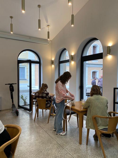 Free Cozy modern café interior in Moscow with people enjoying a relaxing day. Stock Photo