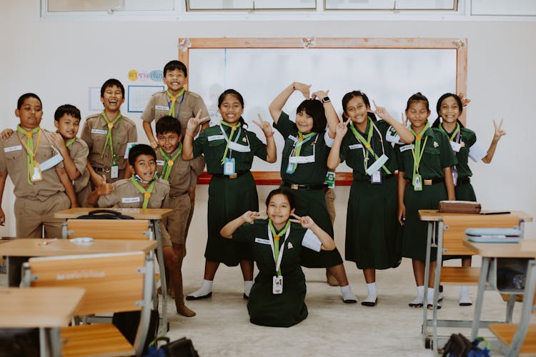 Portrait Of Smiling Scout Boys And Girls in Classroom