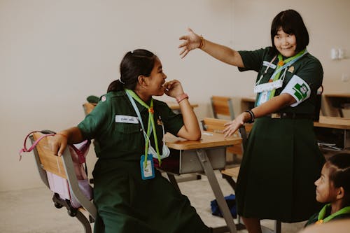 Scout Girls Playing in Classroom