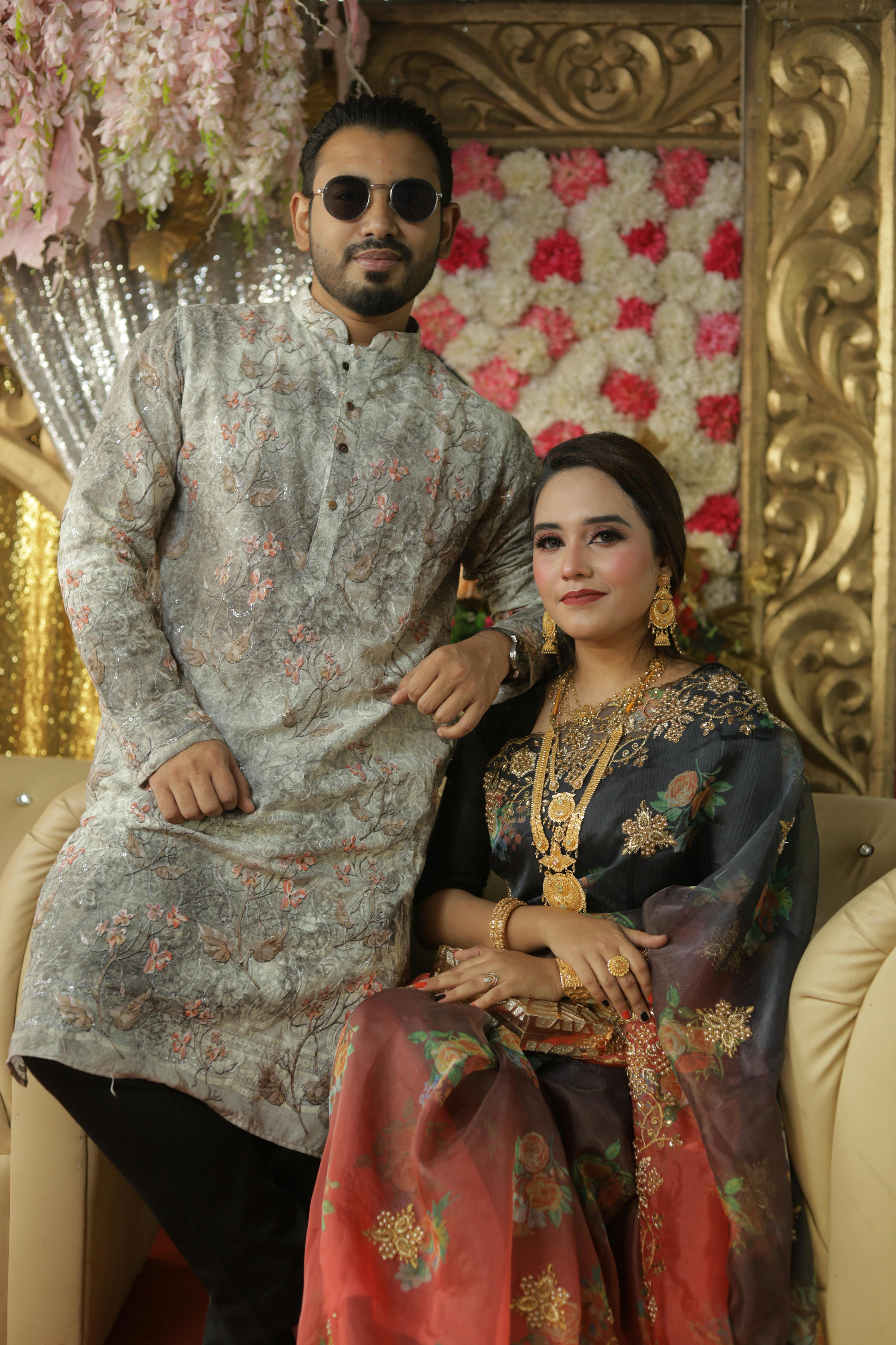 Couple Posing in Traditional Ornamental Clothes · Free Stock Photo