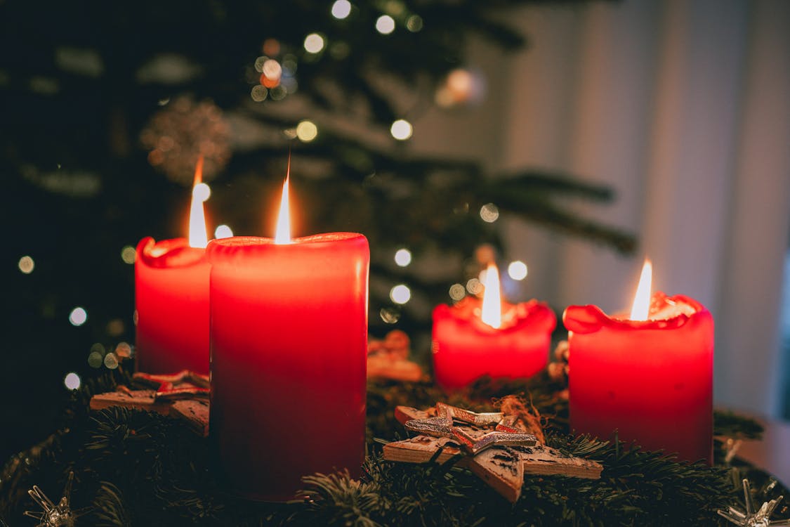 Close-up Photo of Red Lighted Candles 