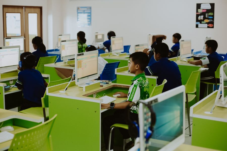 Students building digital skills together in a computer lab