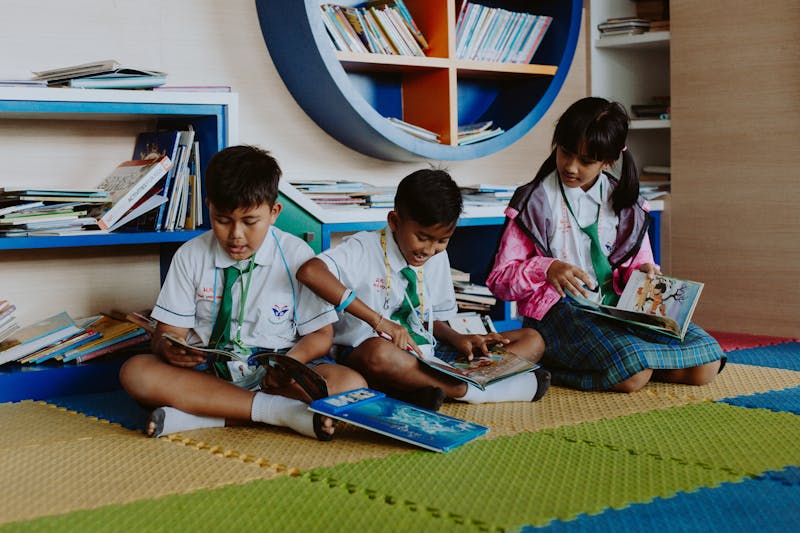 Children reading together in library