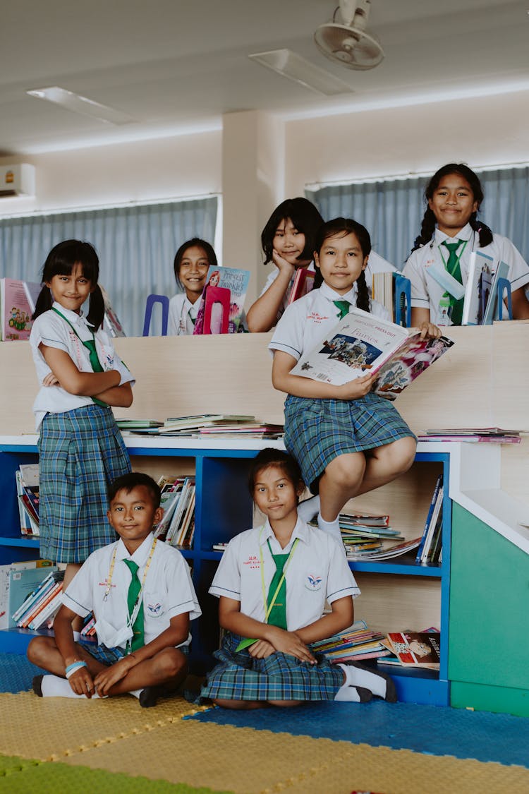 Group Of Students Reading A Book