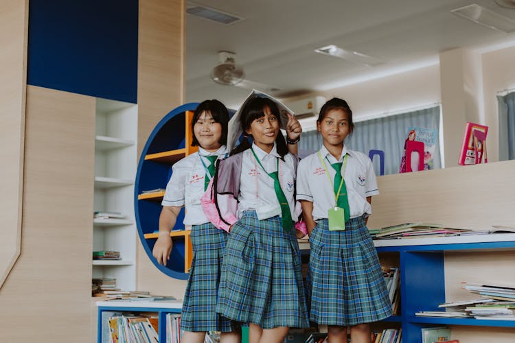 Group Of Students Standing In The Library