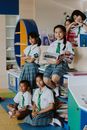 Group of Students Reading a Book