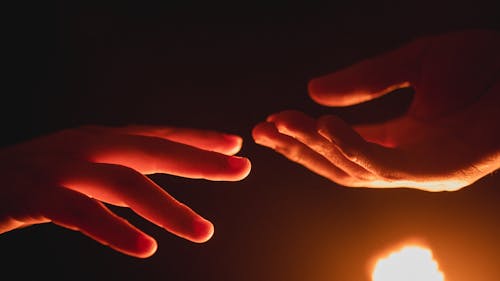 Free Hands Reaching Toward Each Other  Stock Photo