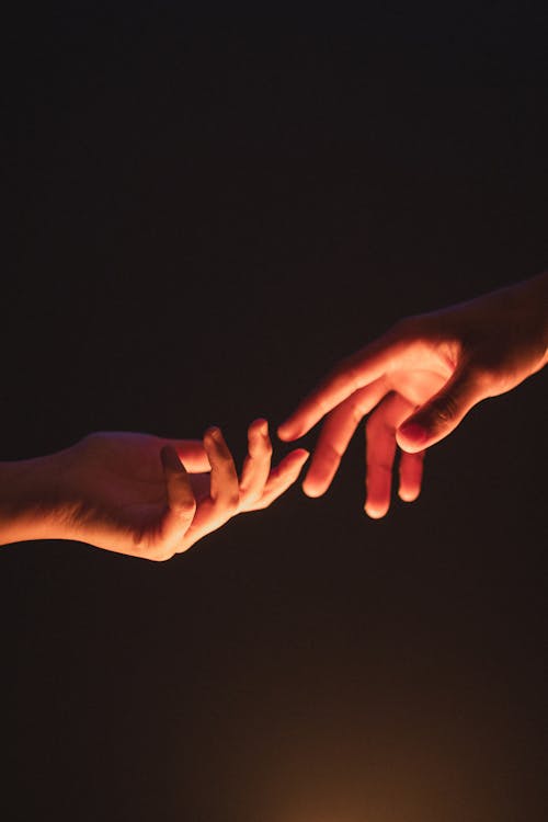 Free Close-Up Shot of Two People Holding Hands Stock Photo