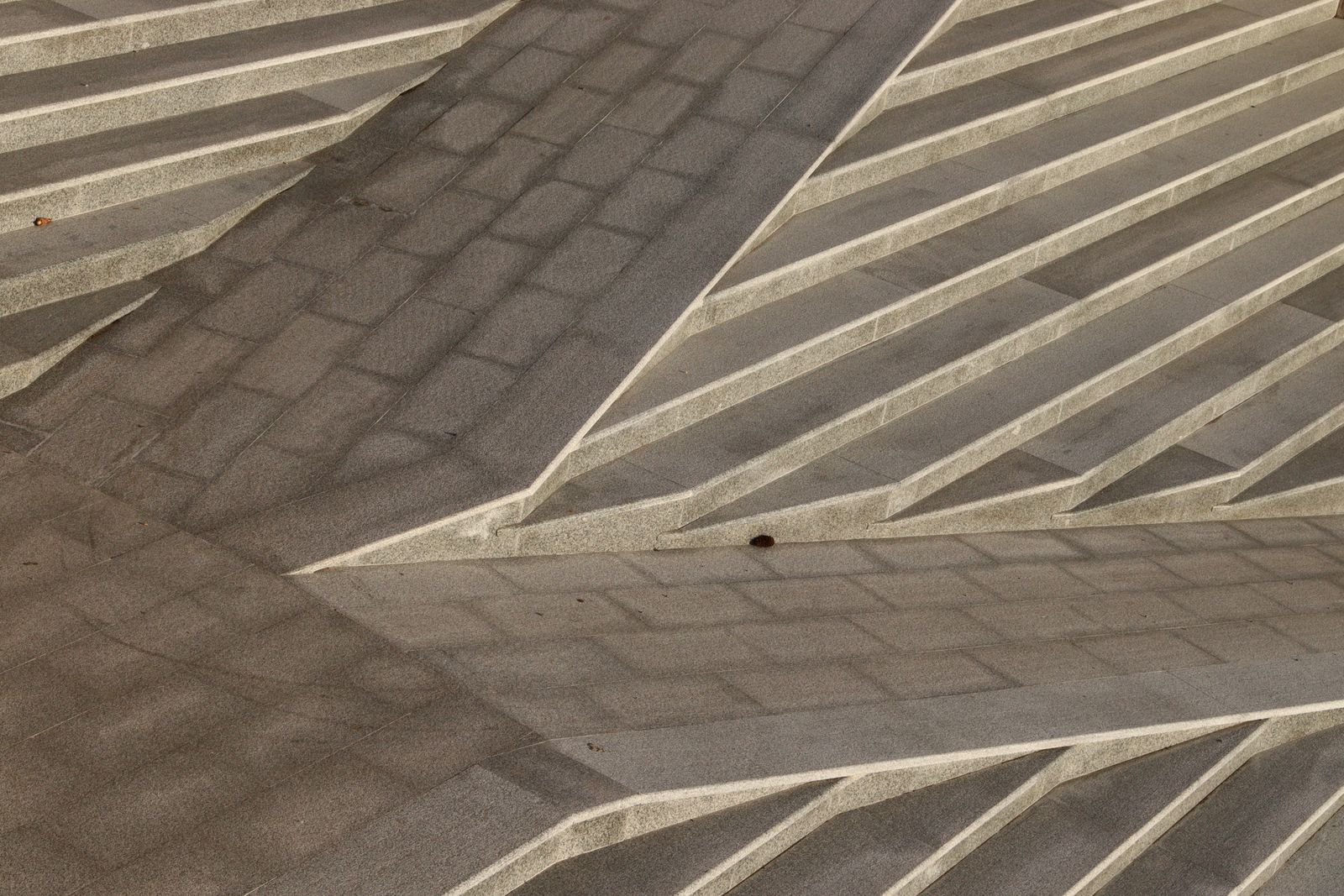 Shadows forming a changing pattern across steps