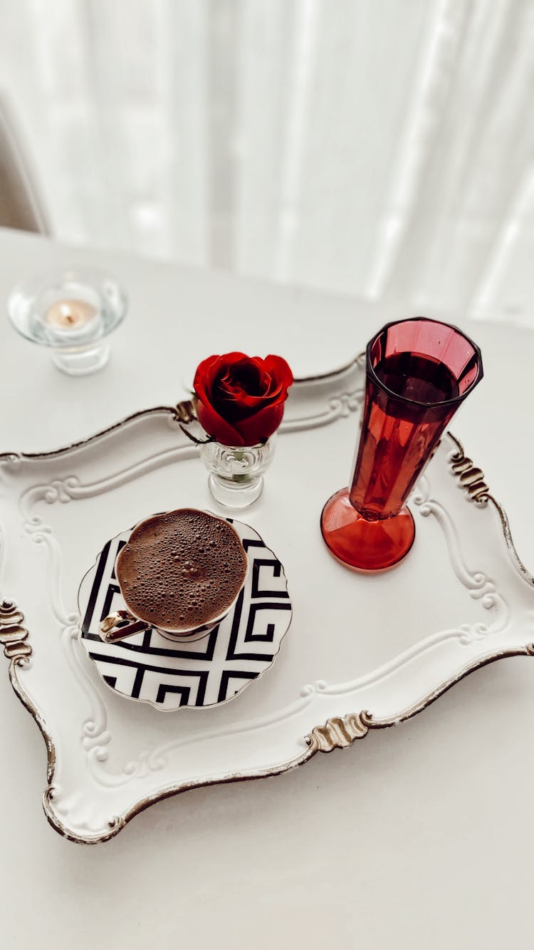 Glass And Cup On A Tray On Table Top 