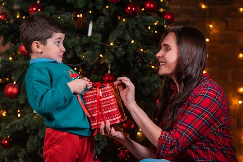 Woman Opening a Present with her Son