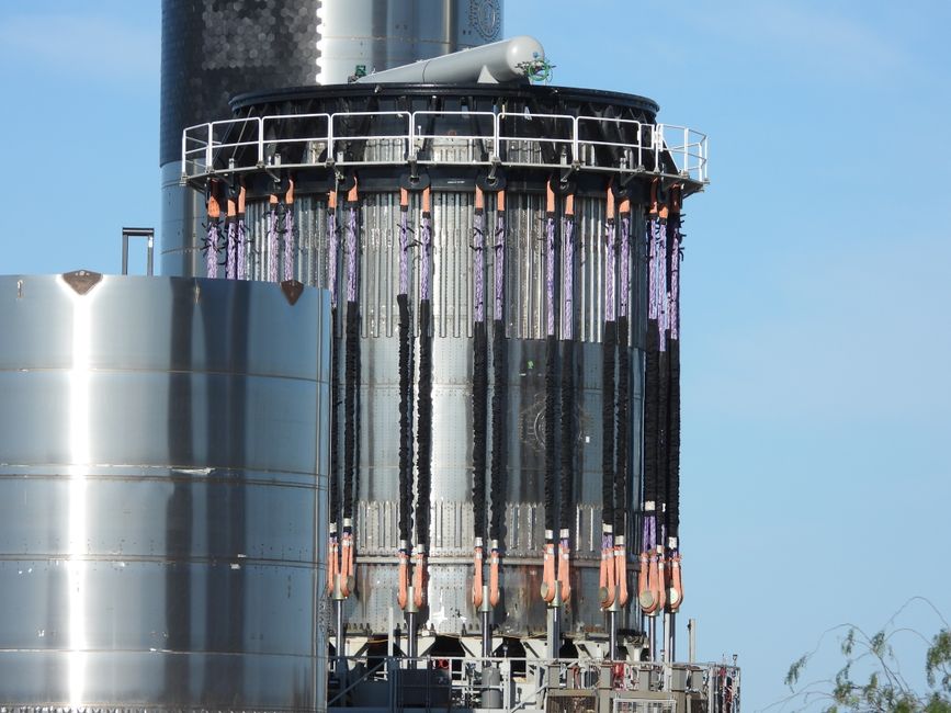 Close-up of a steel structure at SpaceX Starbase in Brownsville, Texas, under a clear blue sky.