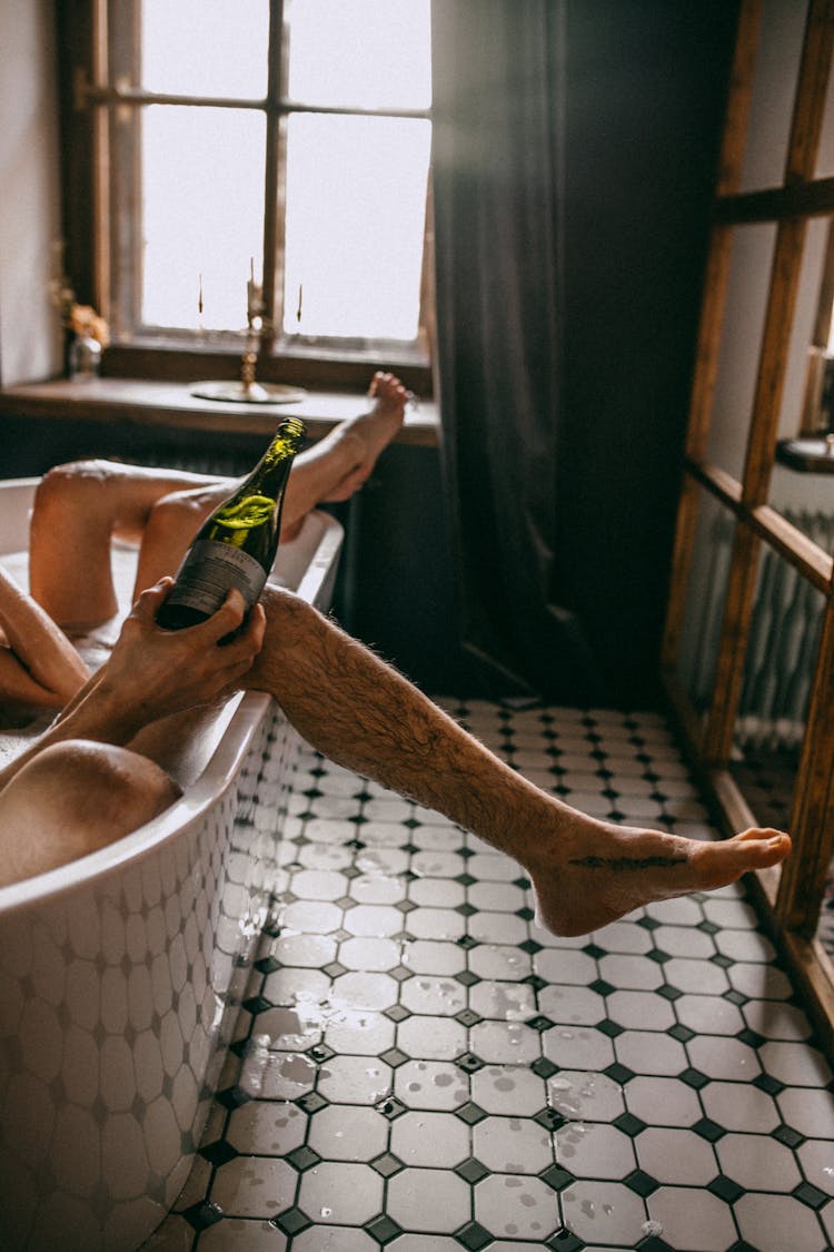 Couple In Bathtub With Champagne