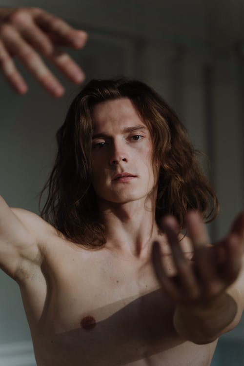 A Long-Haired Topless Man