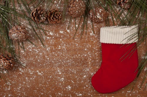 Red and White Christmas Socks on a Wooden Surface 
