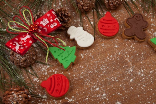 Cookies and Pine Cones on Wooden Surface