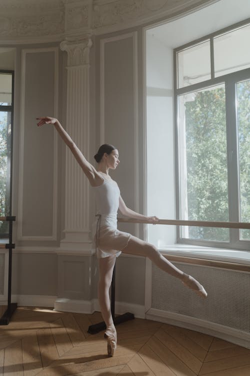 Female Ballerina Dancer dancing on a Practice Room 