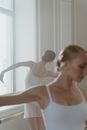 Women in White Leotards Dancing