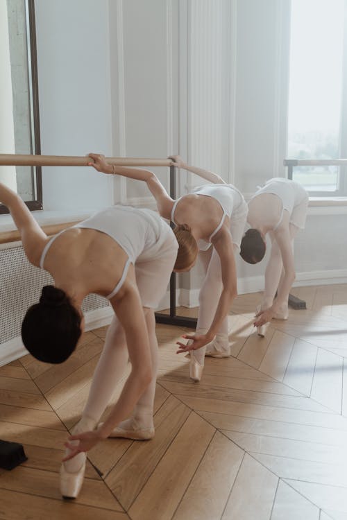 Free Female Ballet Dancers performing on a Practice Room Stock Photo