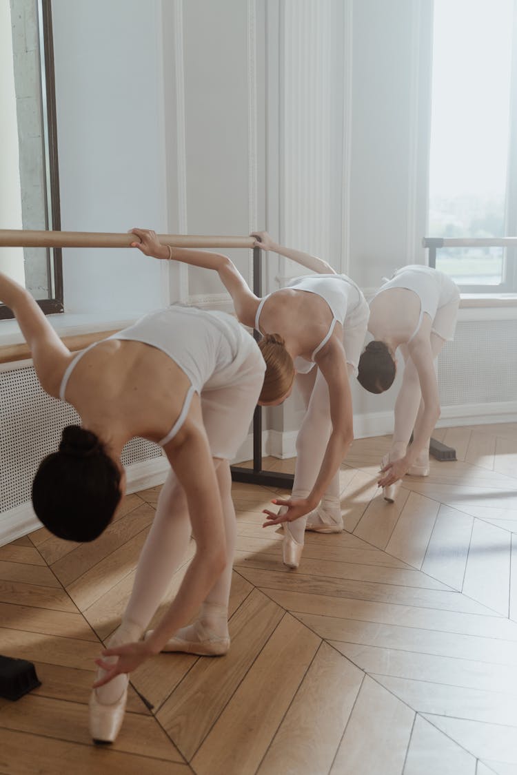 Female Ballet Dancers Performing On A Practice Room