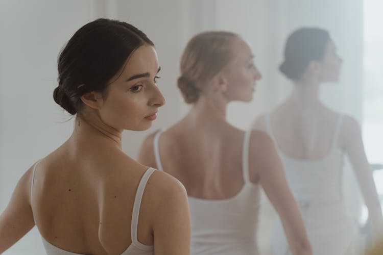 Three Ballerinas From The Back