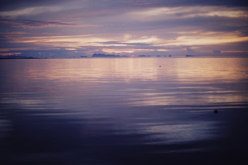 Scenic View of Placid Sea during Sunset