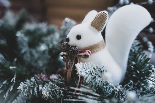 Free White Snowman Ornament on Green Christmas Tree Stock Photo